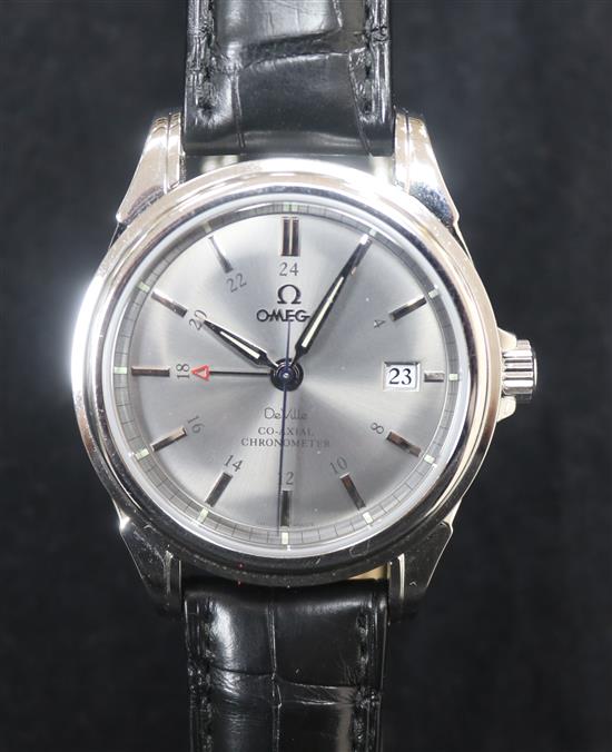 A gentlemans stainless steel Omega GMT Co-Axial automatic wrist watch with box and papers.